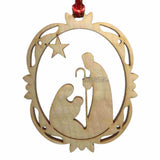 Nativity of Christ carved in the center of a wooden Christmas ornament sold by the sisters of monasterevmc.org / Ornement de Noël, en bois avec une scène de la Nativité du Christ au centre, vendue par les soeurs du monasterevmc.org