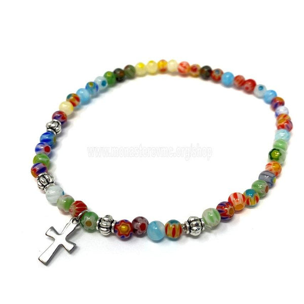 Orthodox millefiori bead bracelet with a silver cross sold by the sisters of monasterevmc.org / Bracelet orthodoxe avec des perles millefiori multicolores et une croix de couleur argent vendu par les soeurs du monasterevmc.org