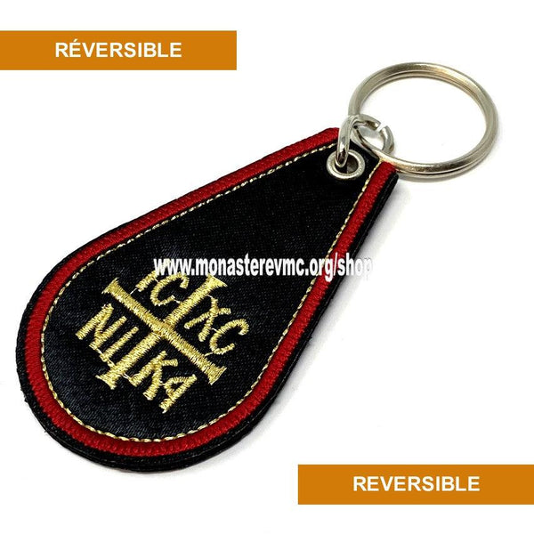 Orthodox key chain imported from Greece. black woven with IC XC NI KA gold embroidery in the front and the prayer to the Theotokos in English on the back. / Porteclé orthodoxe tissé noir avec broderie en or importé de la Grèce vendu par les soeurs du monasterevmc.org